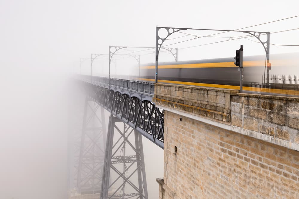 Train on Foggy Bridge by Alvaro Roxo — canvas wall art