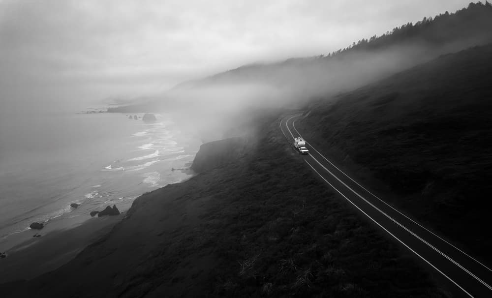 Misty Coastal Road by Aidong Ning — canvas wall art