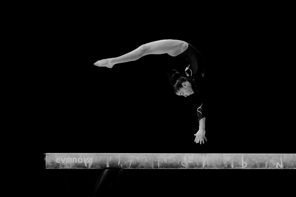 Gymnast Arching On Beam by Howard Ashton-Jones — canvas wall art