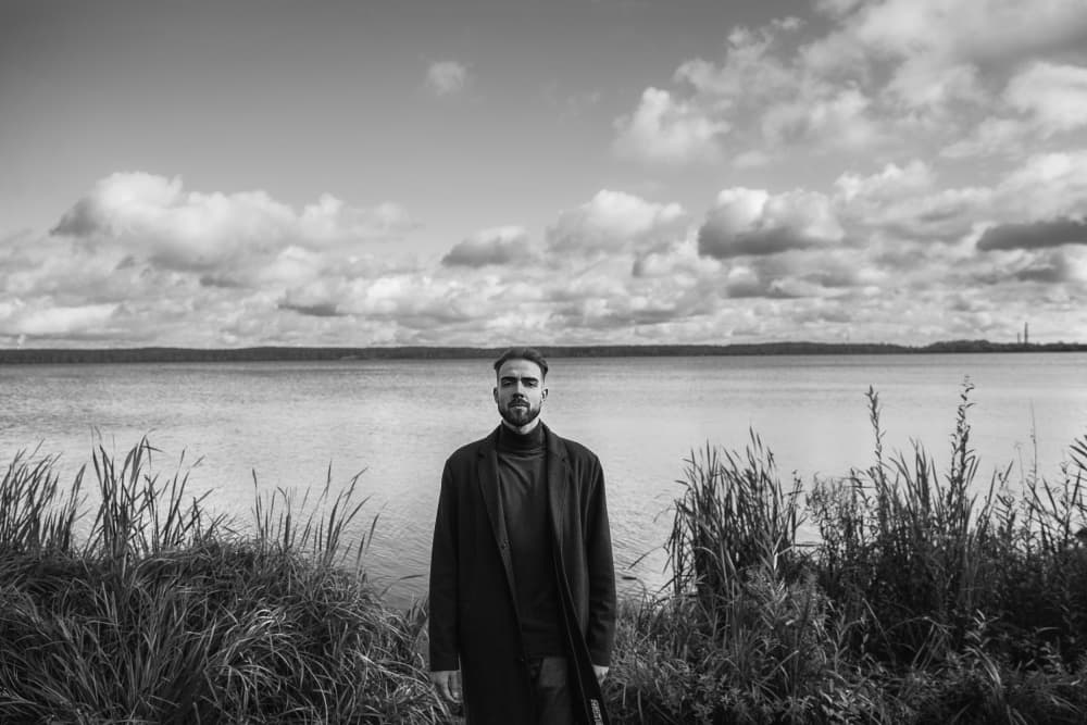 Pensive Man By Water by Tatiana Koshutina — canvas wall art