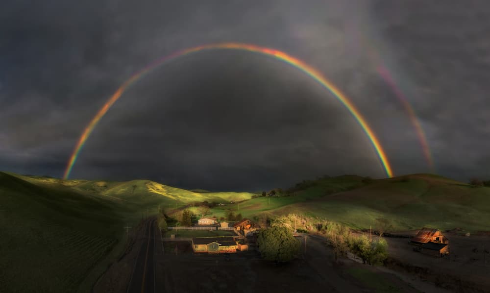 Double Rainbow Over Rolling Hills by Jenny Qiu — canvas wall art