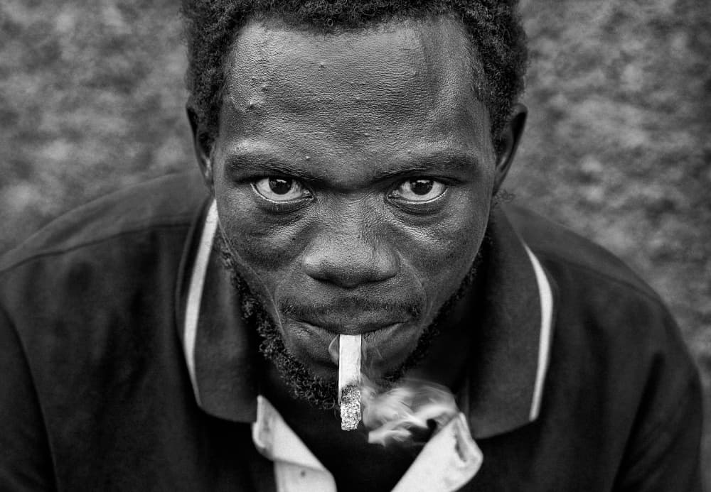 Man Smoking Intense Gaze by Joxe Inazio Kuesta Garmendia — canvas wall art
