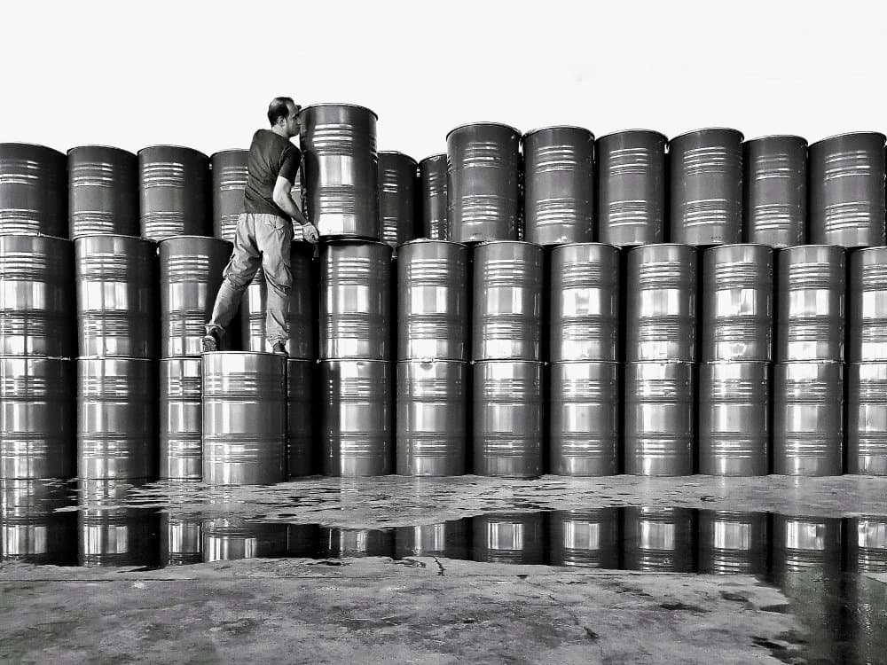 Worker Stacking Barrels by Mohammad Fotouhi — canvas wall art