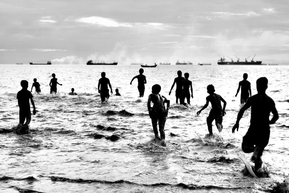 Children Playing Ocean Silhouettes by Siraj Akram Kayes — canvas wall art