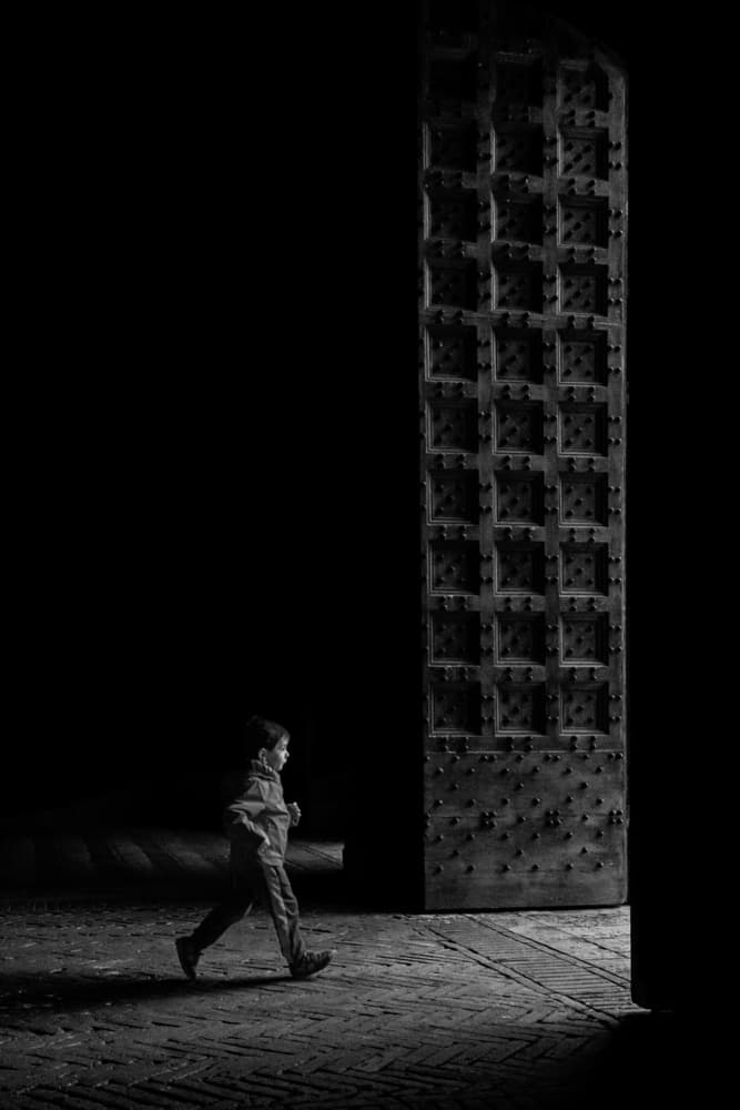 Child In The Doorway by Luca Domenichi — canvas wall art
