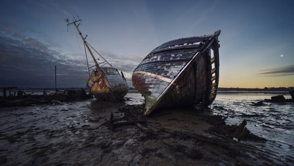 Coastal Boat Graveyard by Hans Repelnig — canvas wall art