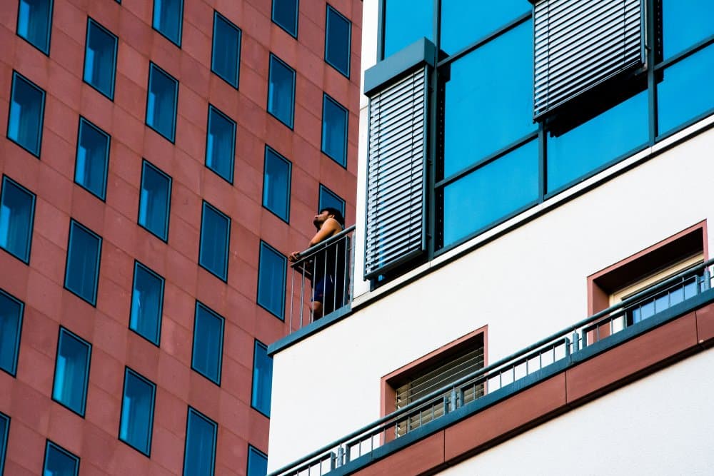 Man on Urban Balcony by Heike Wolters-Wrase — canvas wall art