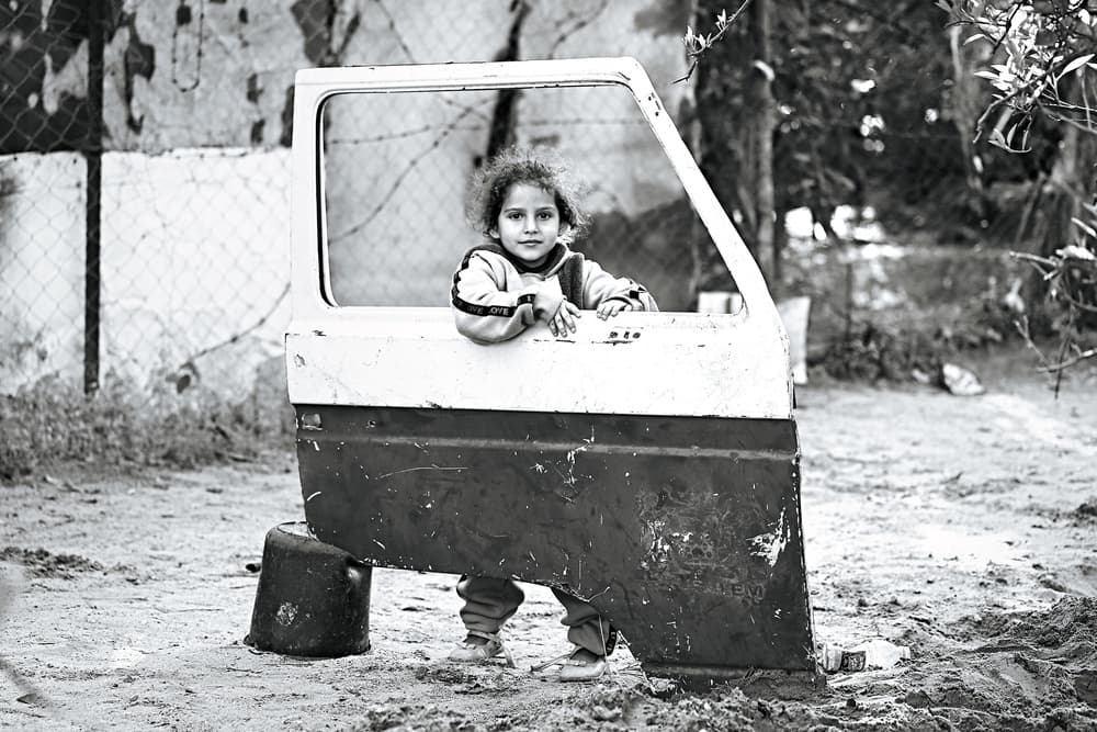 Child in Car Door by Hazem Swidan — canvas wall art