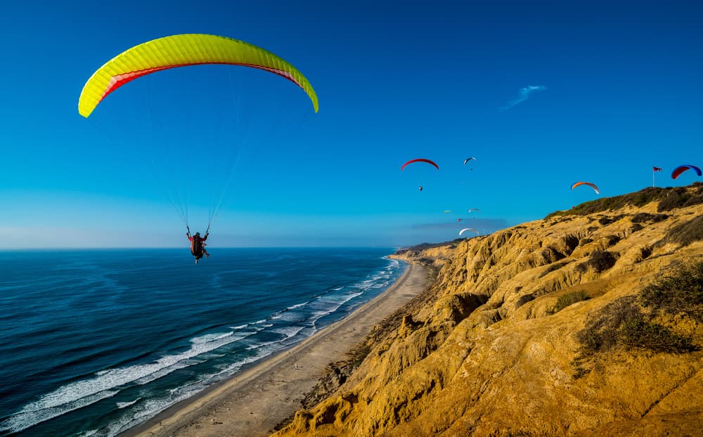 Coastal Paragliding Flight by Andreas Agazzi — canvas wall art
