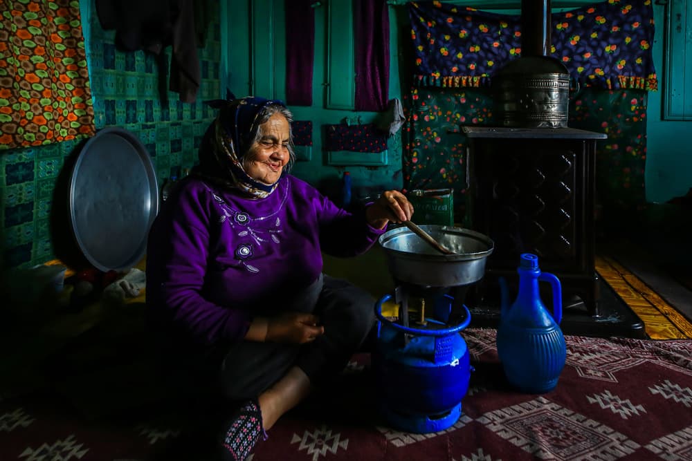 Happy Woman Cooking by Ummu Nisan Kandilcioglu — canvas wall art