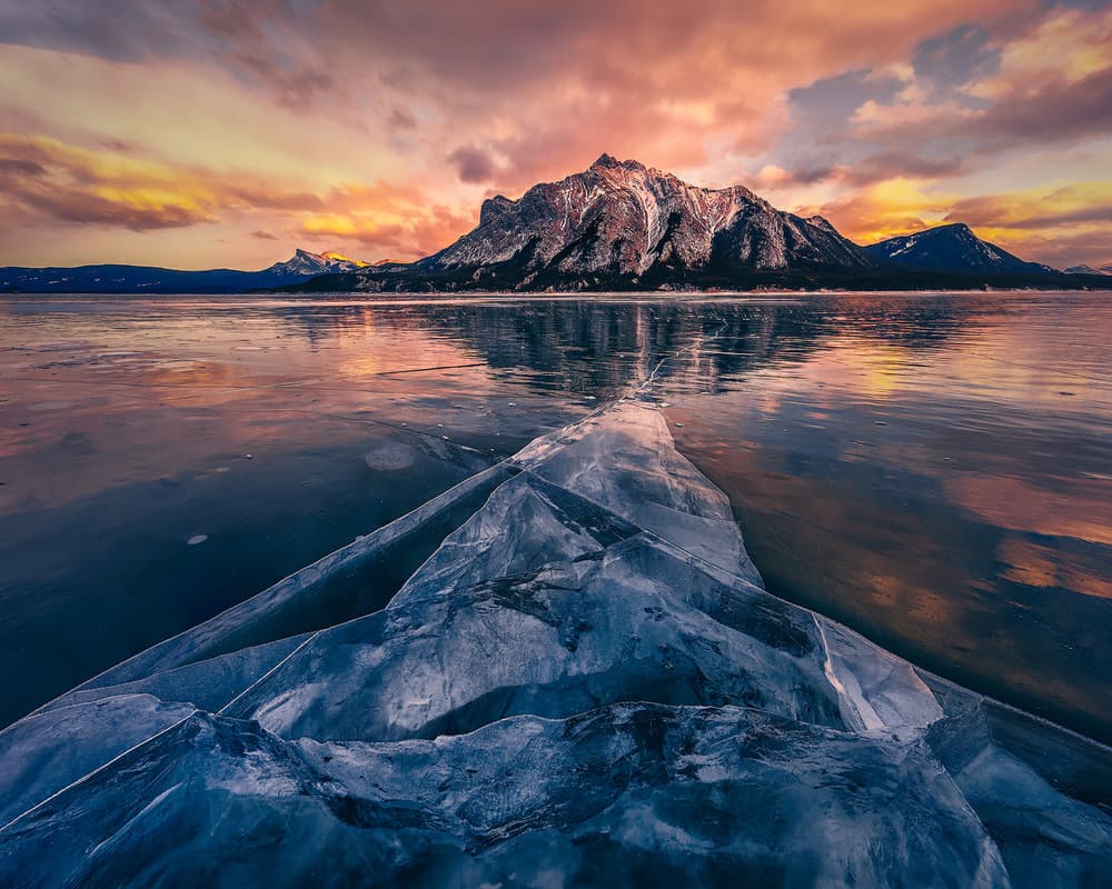 Frozen Lake Mountain Sunset by Yimei Sun — canvas wall art
