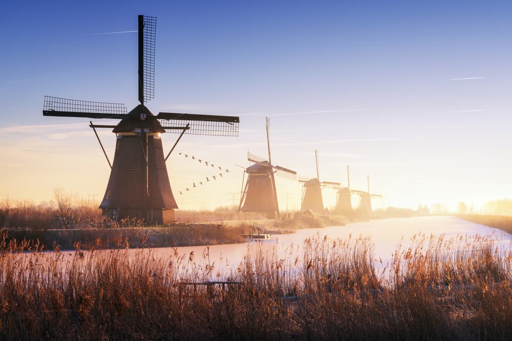 Misty Dutch Windmills by Juan Pablo de Miguel — canvas wall art