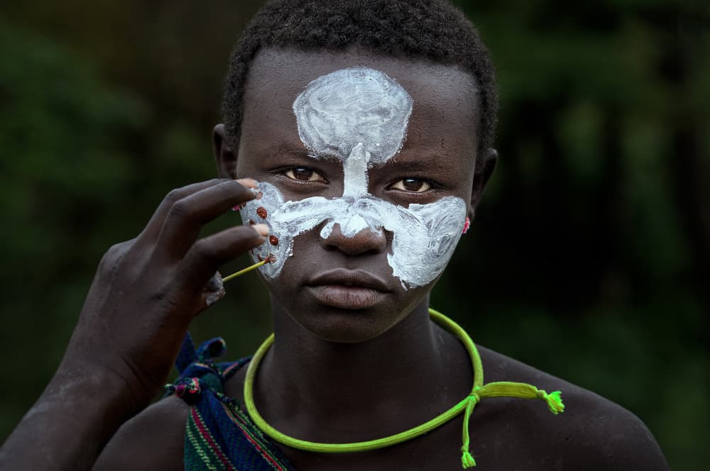 Young Boy Face Paint by Joxe Inazio Kuesta Garmendia — canvas wall art