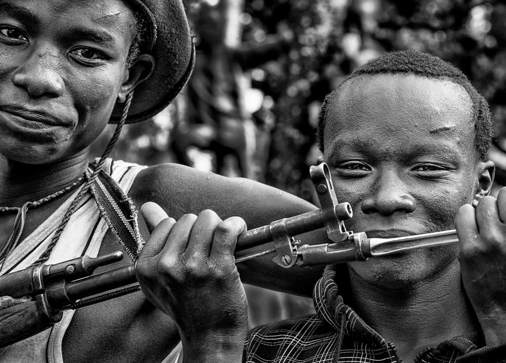 Youthful Smiles And Rifles by Joxe Inazio Kuesta Garmendia — canvas wall art