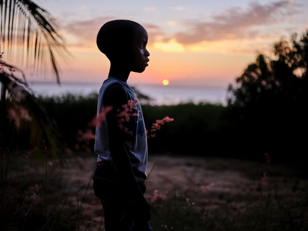 Boy Watching Sunset by Luís Godinho — canvas wall art