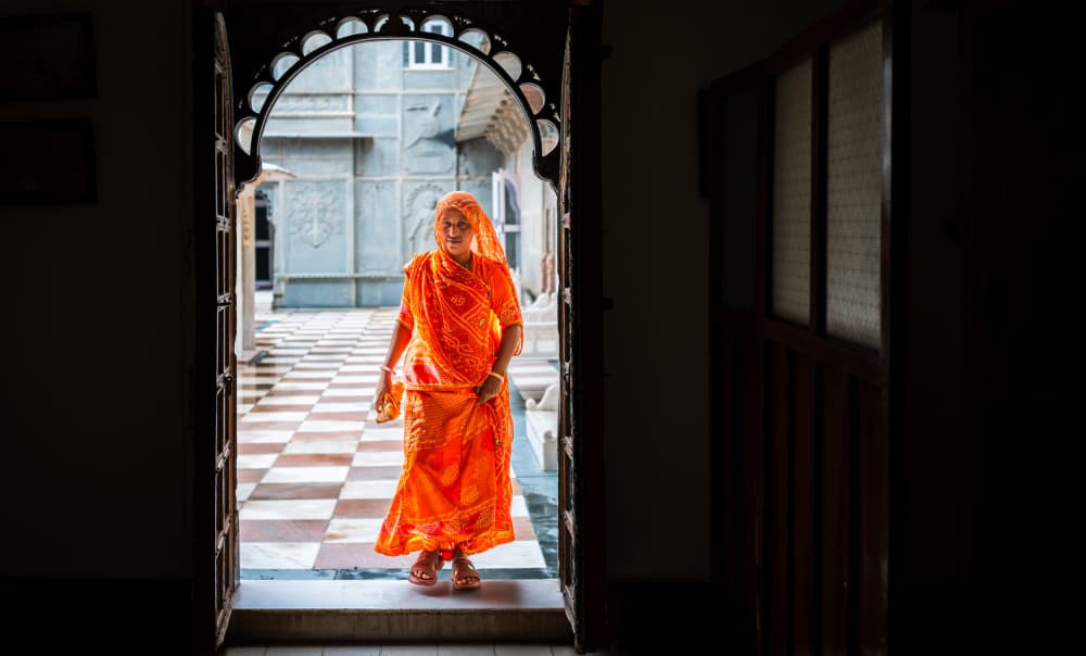 Orange Saree Through Archway by Alan Kwang — canvas wall art