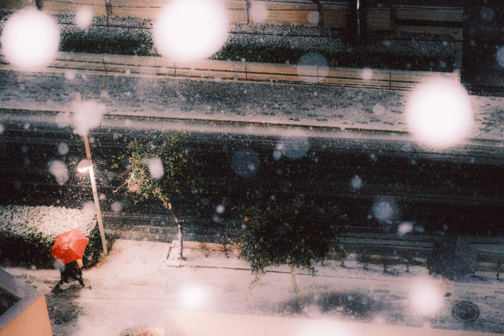 Red Umbrella Snowfall by HIDASAN — canvas wall art