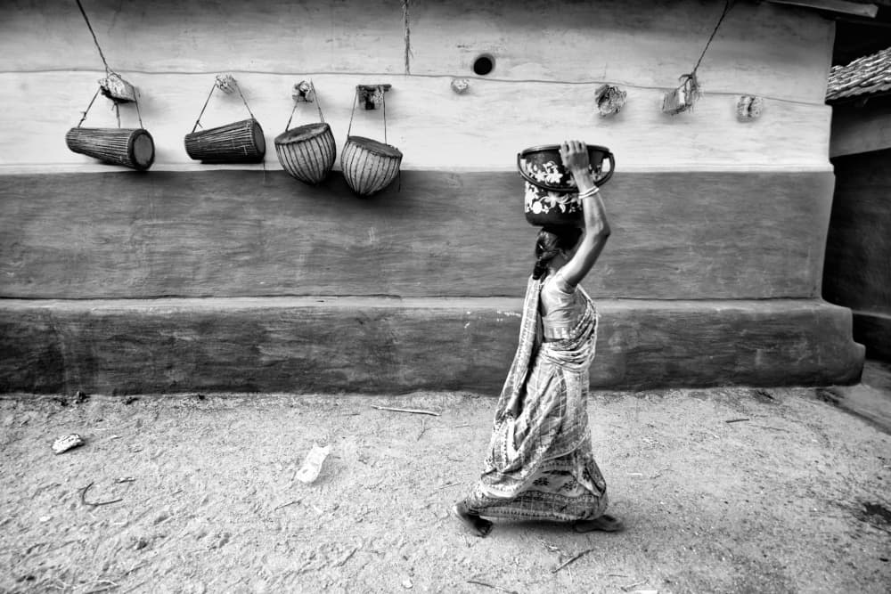 Village Woman Carrying Pot by Shaibal Nandi — canvas wall art