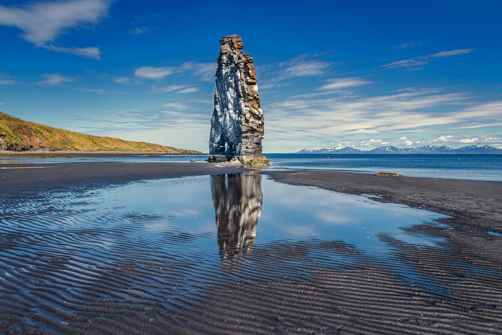 Reflected Sea Stack Shore by Jeffrey C. Sink — canvas wall art