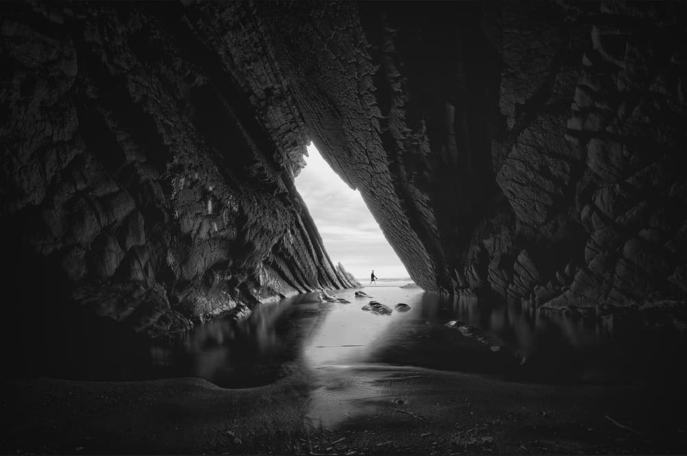 Coastal Cave Silhouette by Alexander Jikharev — canvas wall art