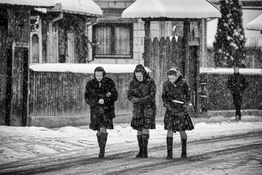Traditional Winter Village Walk by mihai ian nedelcu — canvas wall art