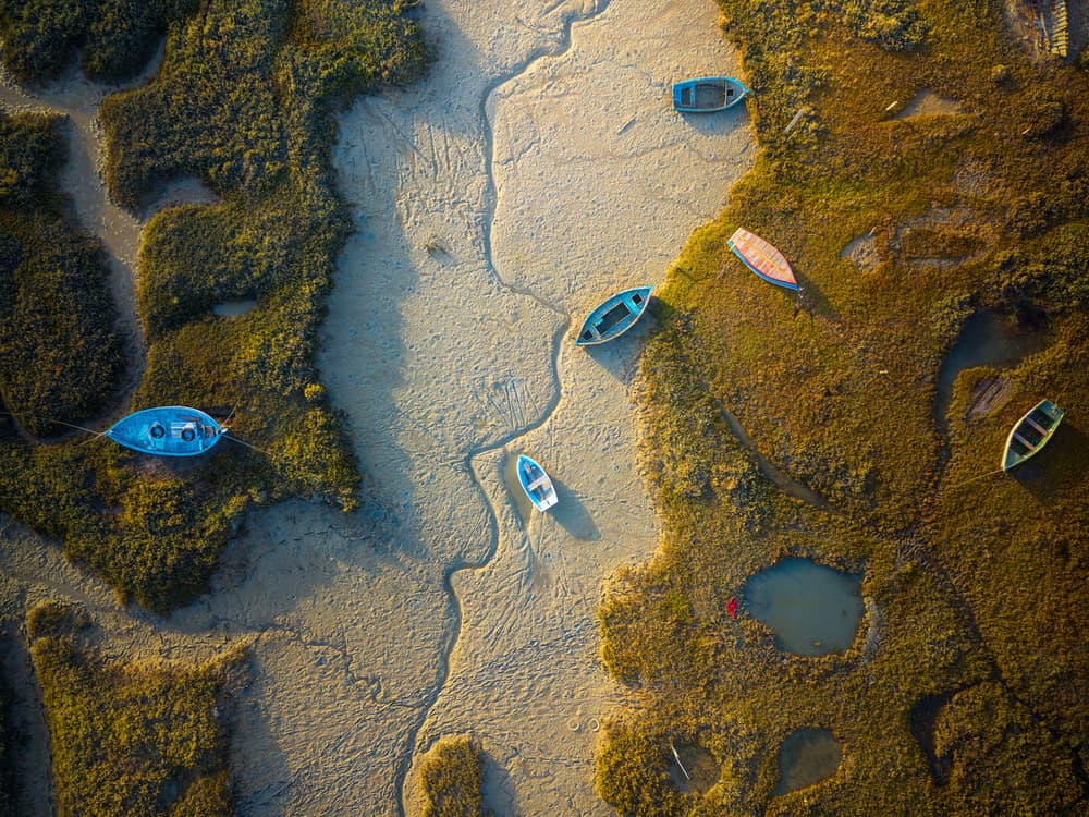 Boats In Tidal Marsh by Josema Martin Espinar — canvas wall art