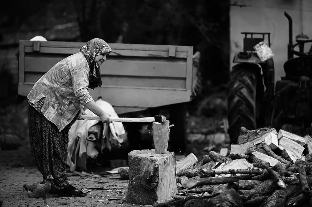 Rural Woman Chopping Wood by nebula — canvas wall art