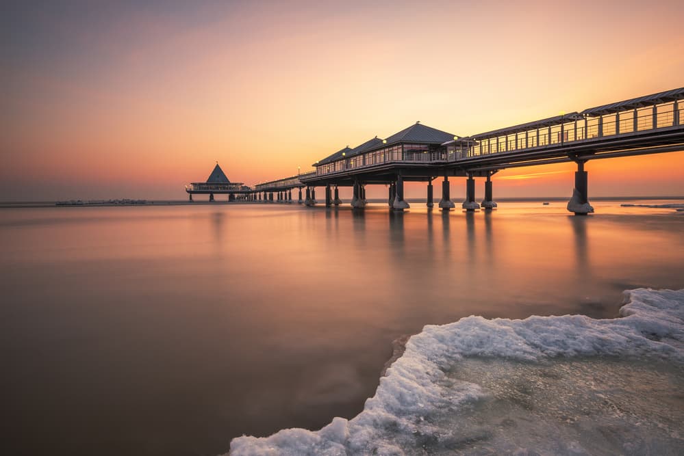 Pier Sunset Glow by Robin Oelschlegel — canvas wall art