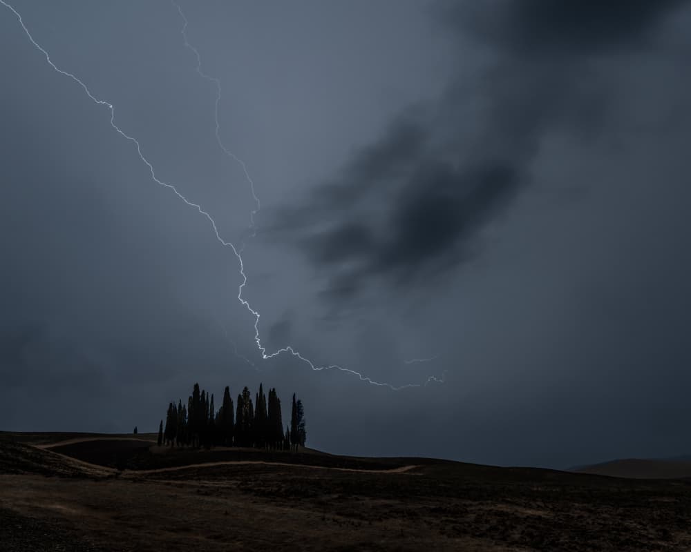 Lightning Storm Over Hills by Luca Domenichi — canvas wall art