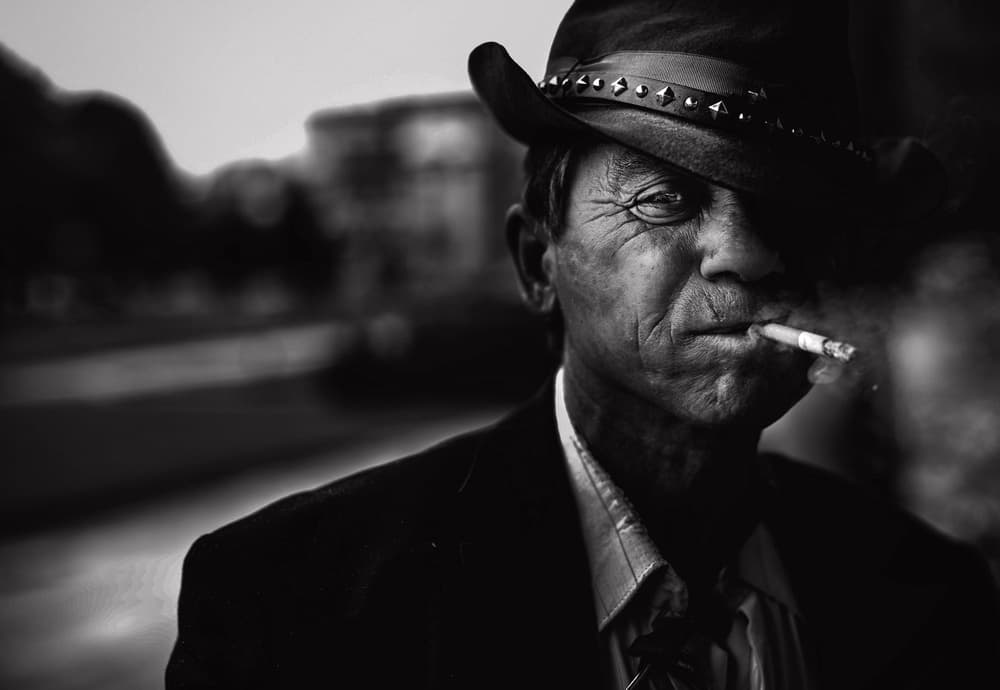 Man Smoking In Fedora by Koki Jovanovic — canvas wall art