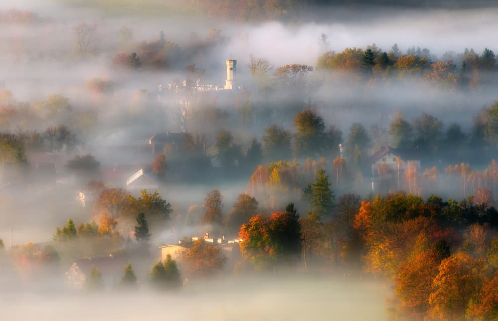 Misty Autumn Village by Piotr Krol (Bax) — canvas wall art