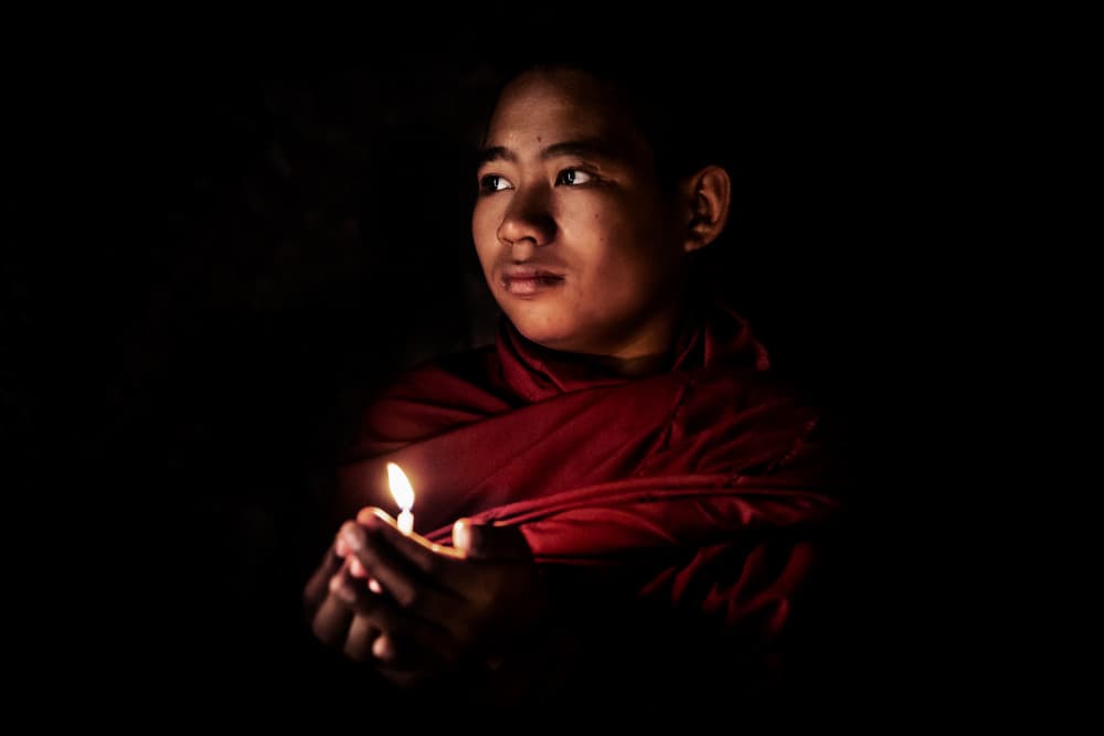 Young Monk's Candle Light by Gloria Staffa — canvas wall art