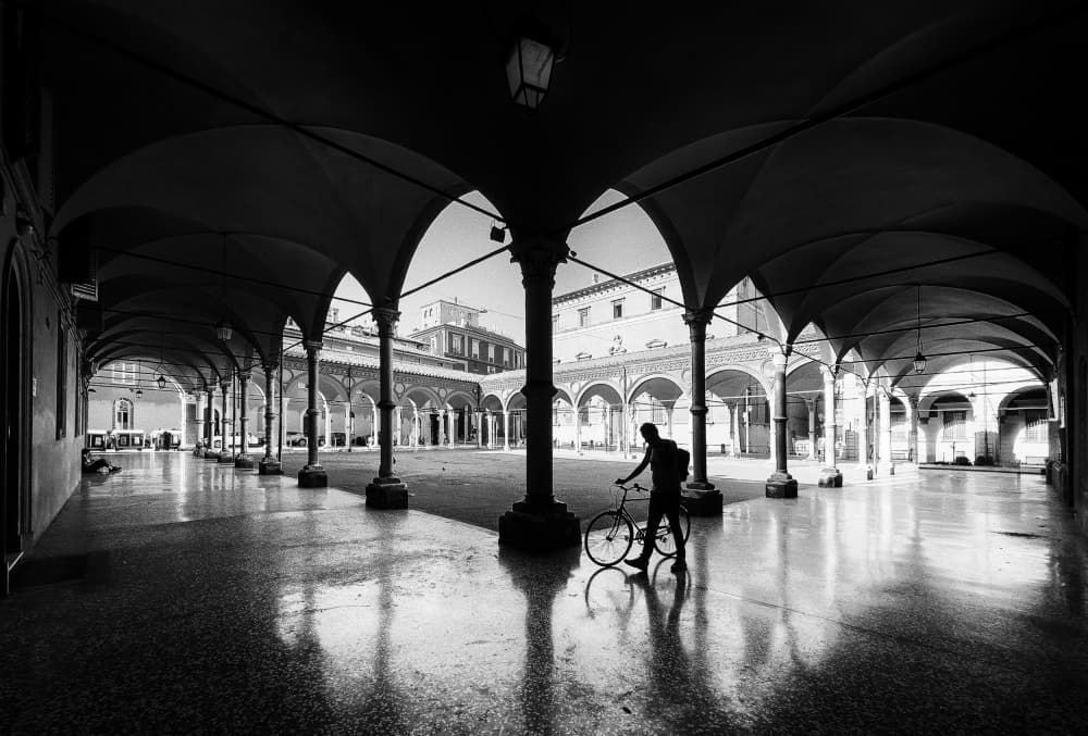 Cyclist in Historic Arches by Adam Dauria ☂ — canvas wall art