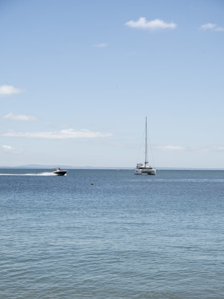 Speedboat and Sailboat by Christa Stroo — canvas wall art