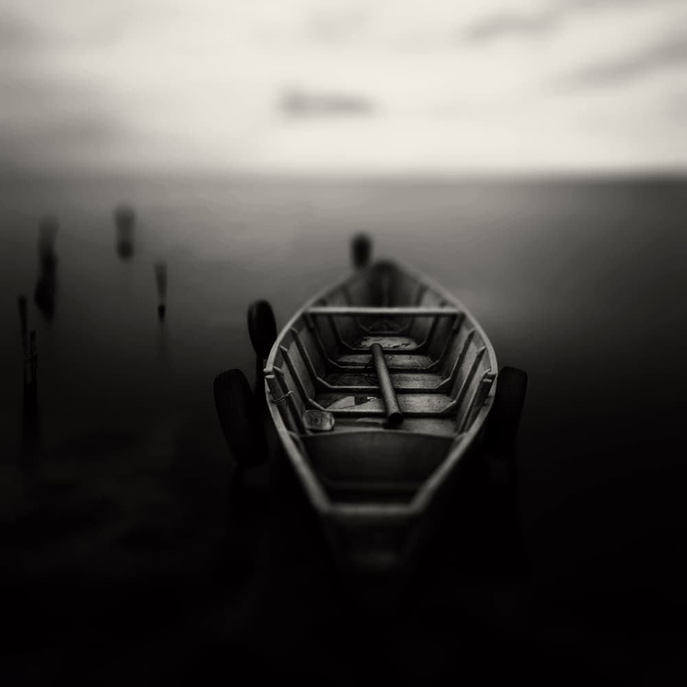 Timeless Boat on Dark Water by Walter Caterina — canvas wall art