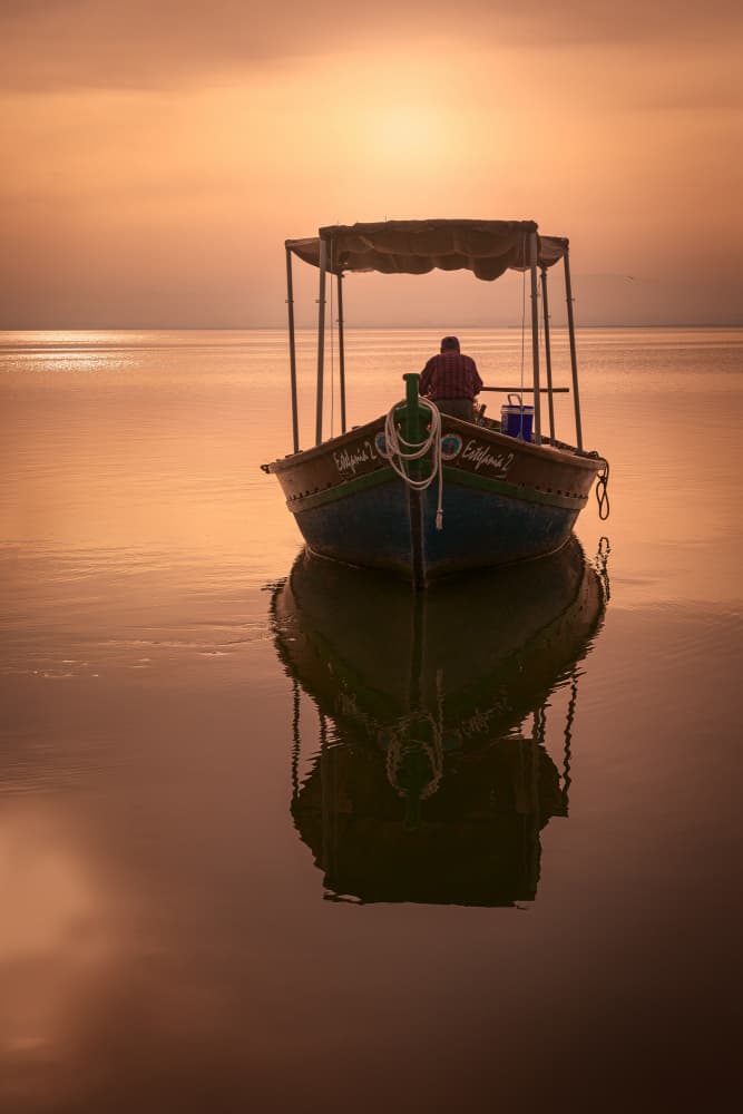 Sunset Boat Reflection by Gustavo Ribes — canvas wall art