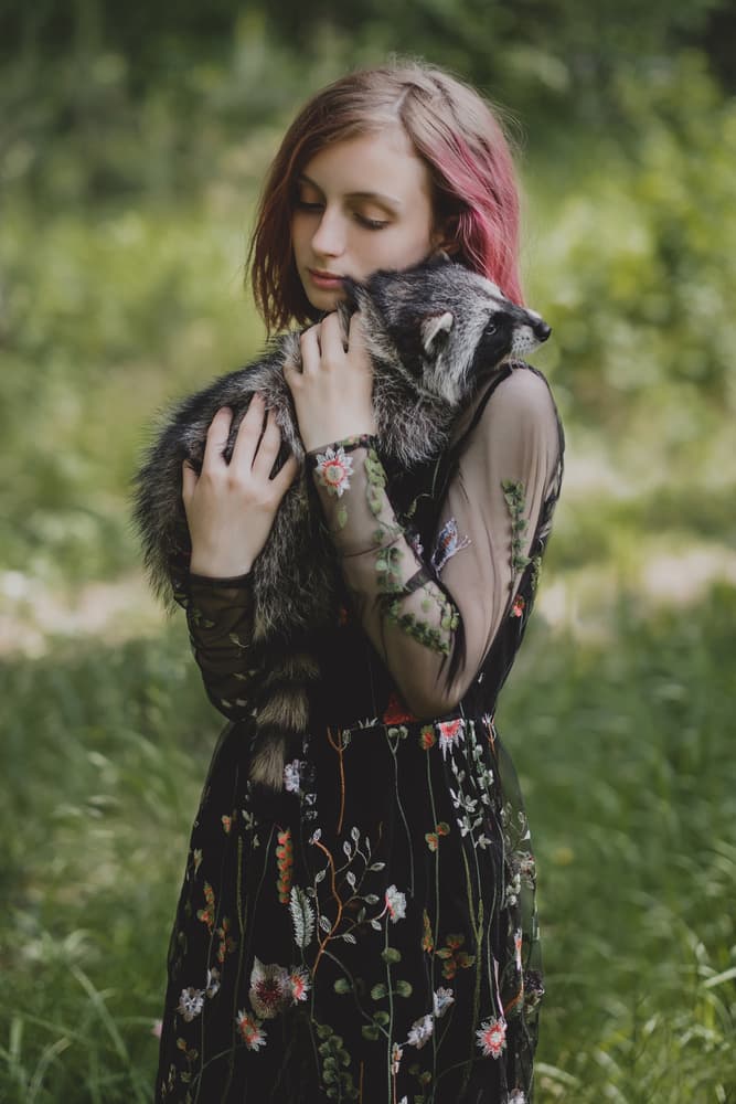 Girl's Raccoon Embrace by Olga Barantseva — canvas wall art
