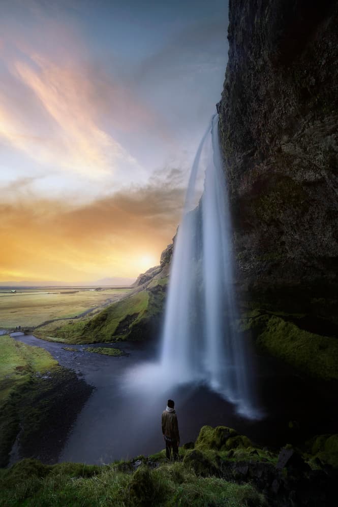 Man At Majestic Waterfall by Jorge Ruiz Dueso — canvas wall art