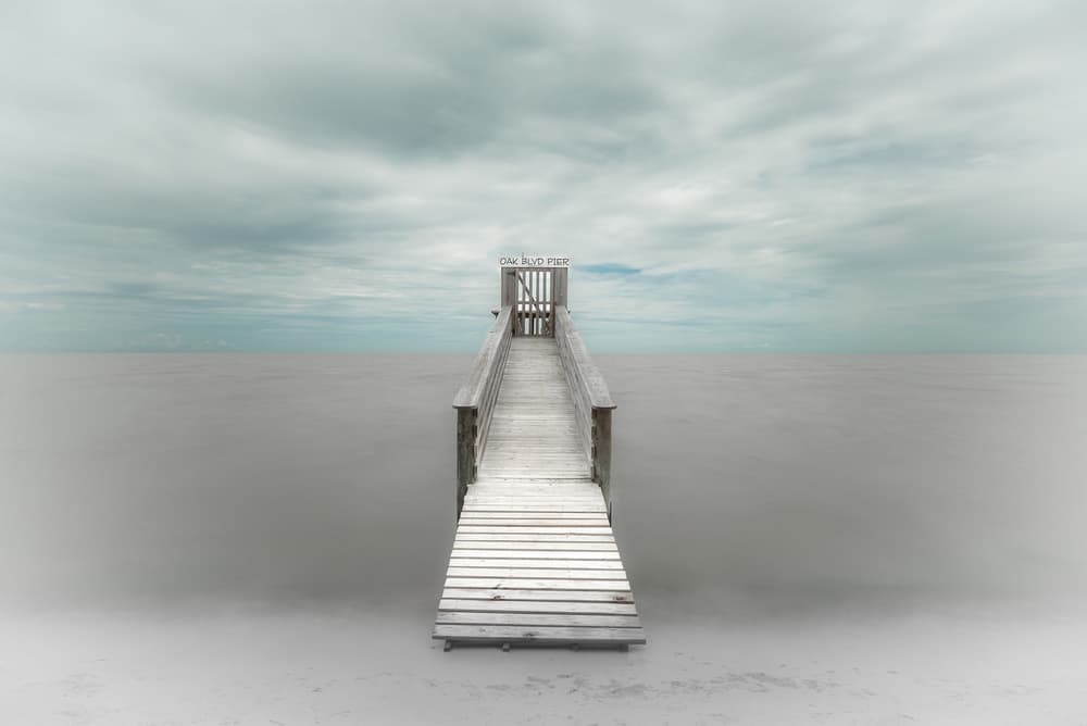 Solitary Wooden Pier by Martin Steeb — canvas wall art