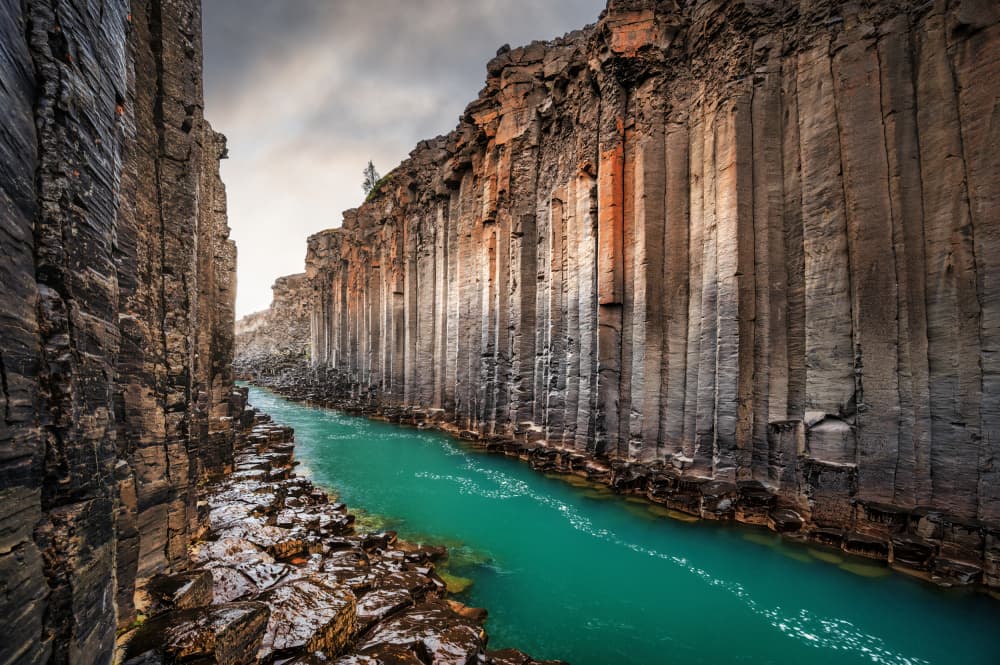 Basalt Canyon River Flow by Marc van Oostrum — canvas wall art
