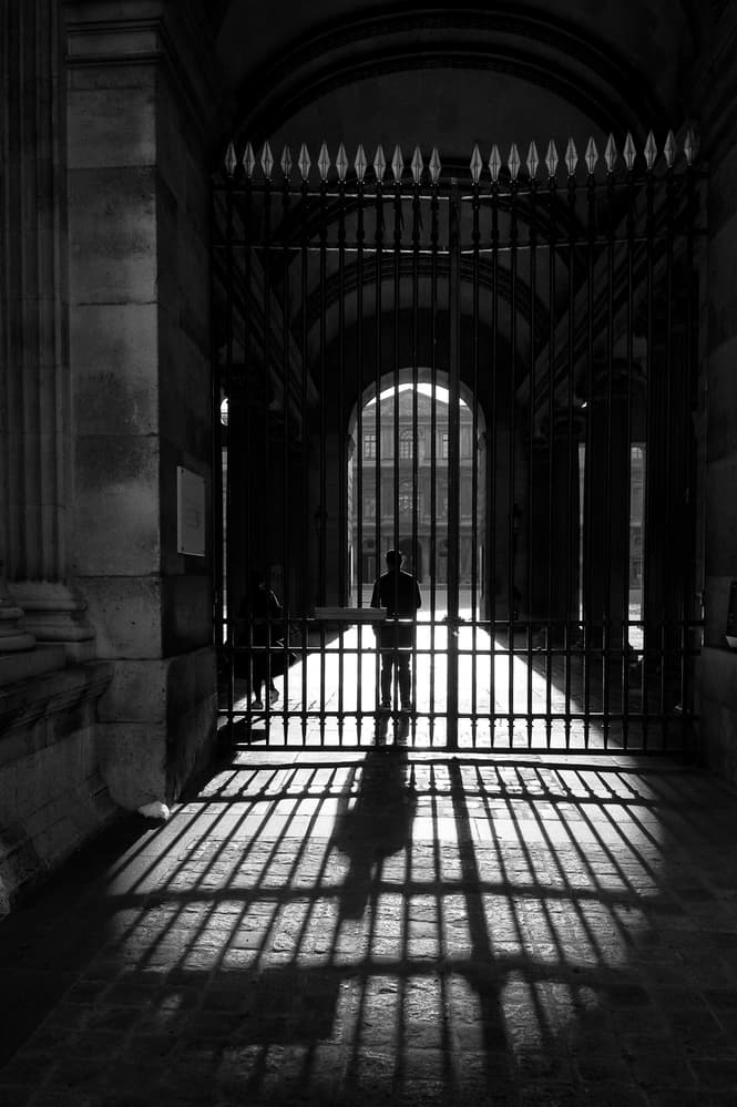Lone Figure Gate Shadow by Eric Drigny — canvas wall art