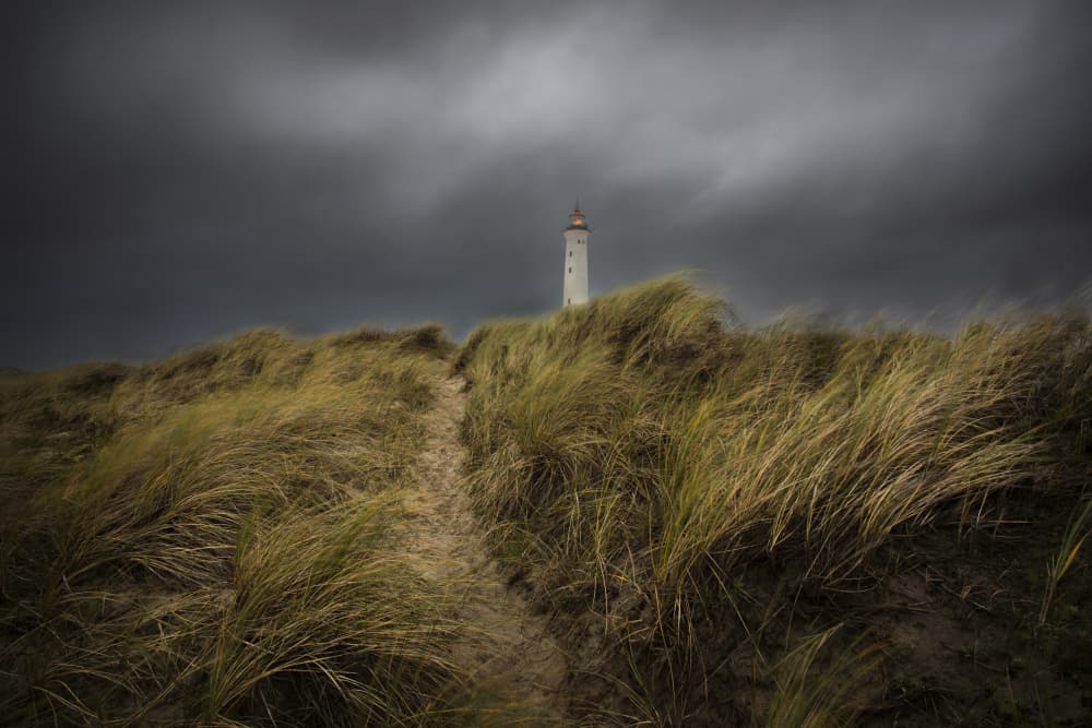 Moody Lighthouse on Dunes by Clas Gustafson PRO — canvas wall art