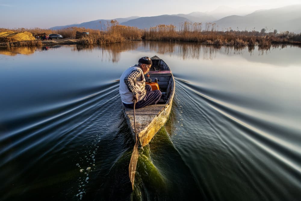 Solitary Boat Ride by Zühdü Bilgin — canvas wall art