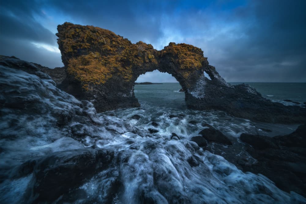 Rugged Coastal Arch by Carlos Gonzalez — canvas wall art