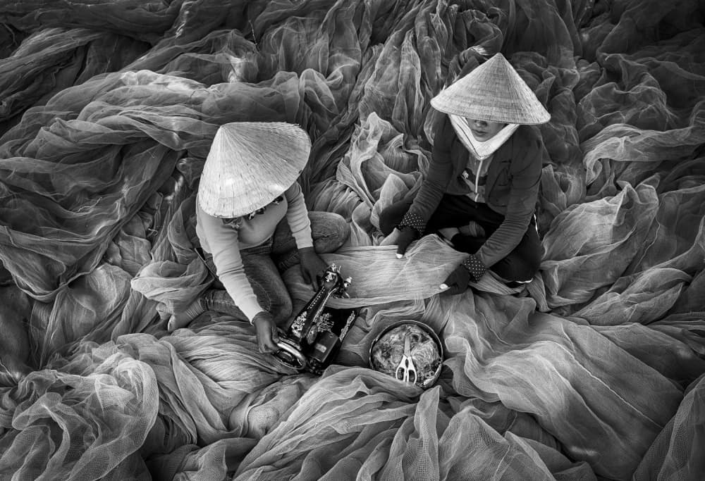 Women Mending Nets by Angela Muliani Hartojo — canvas wall art