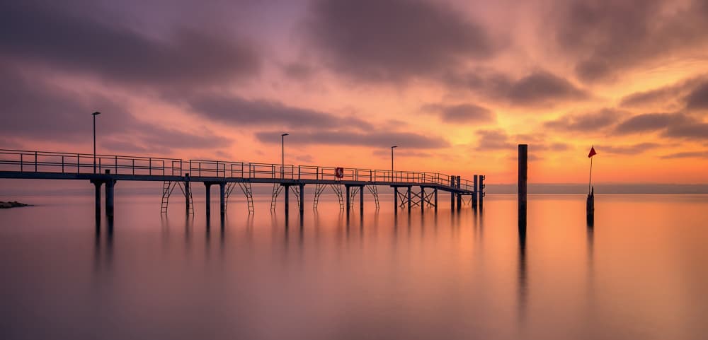 Tranquil Pier Sunset by Judith Kuhn — canvas wall art
