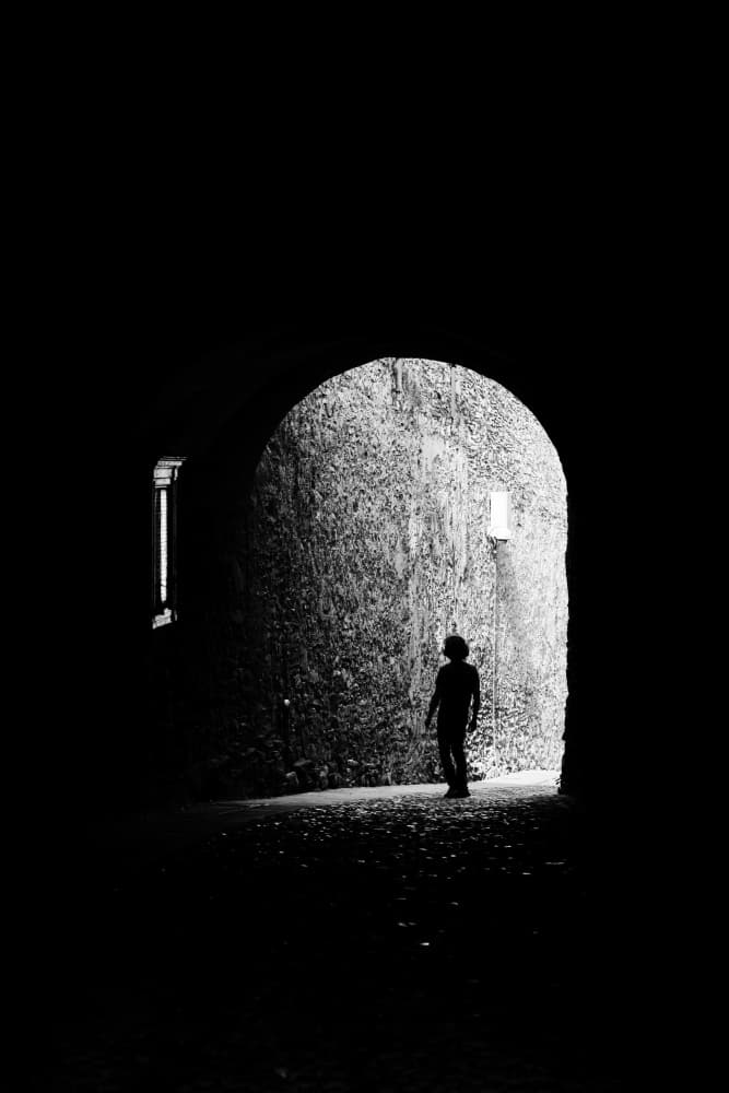 Lone Figure in Archway by Elena Raceala — canvas wall art