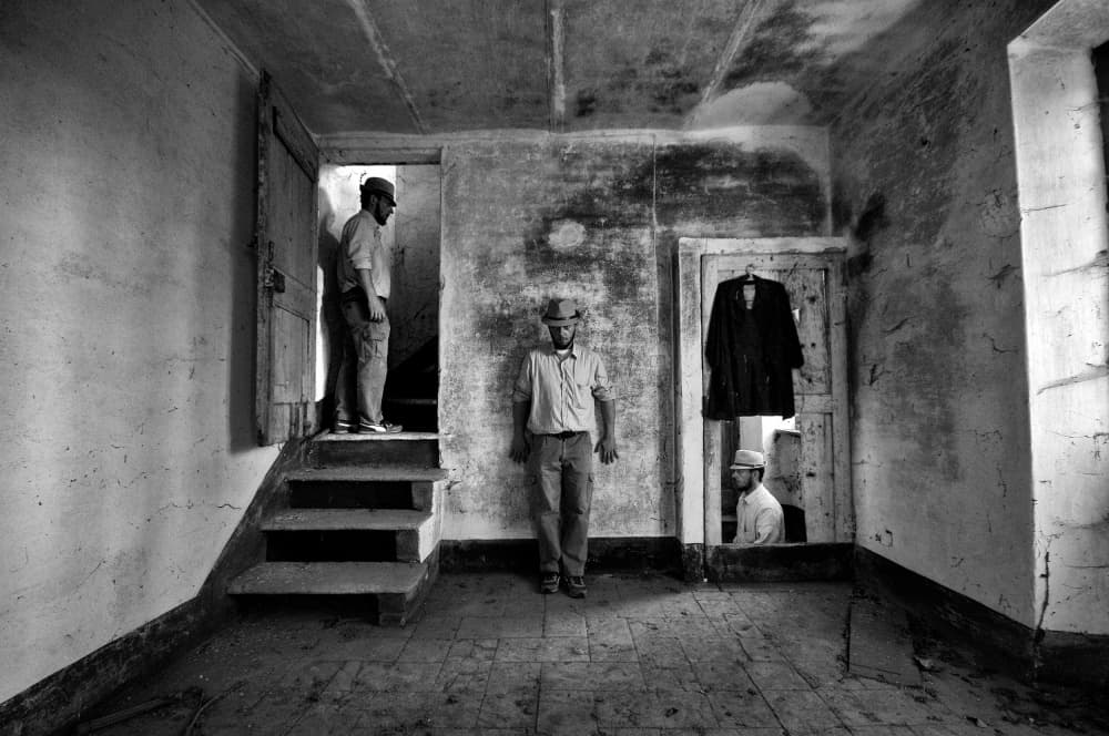 Men In Old House by Carlo Ferrara — canvas wall art