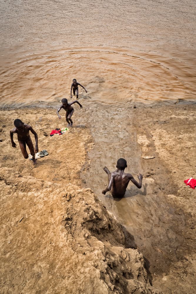 Joyful Mud Play by Melih Karakaya — canvas wall art