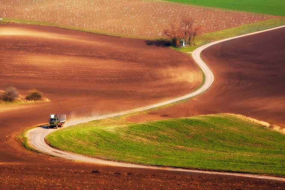 Truck On Winding Farm Road by Przemyslaw Kruk — canvas wall art